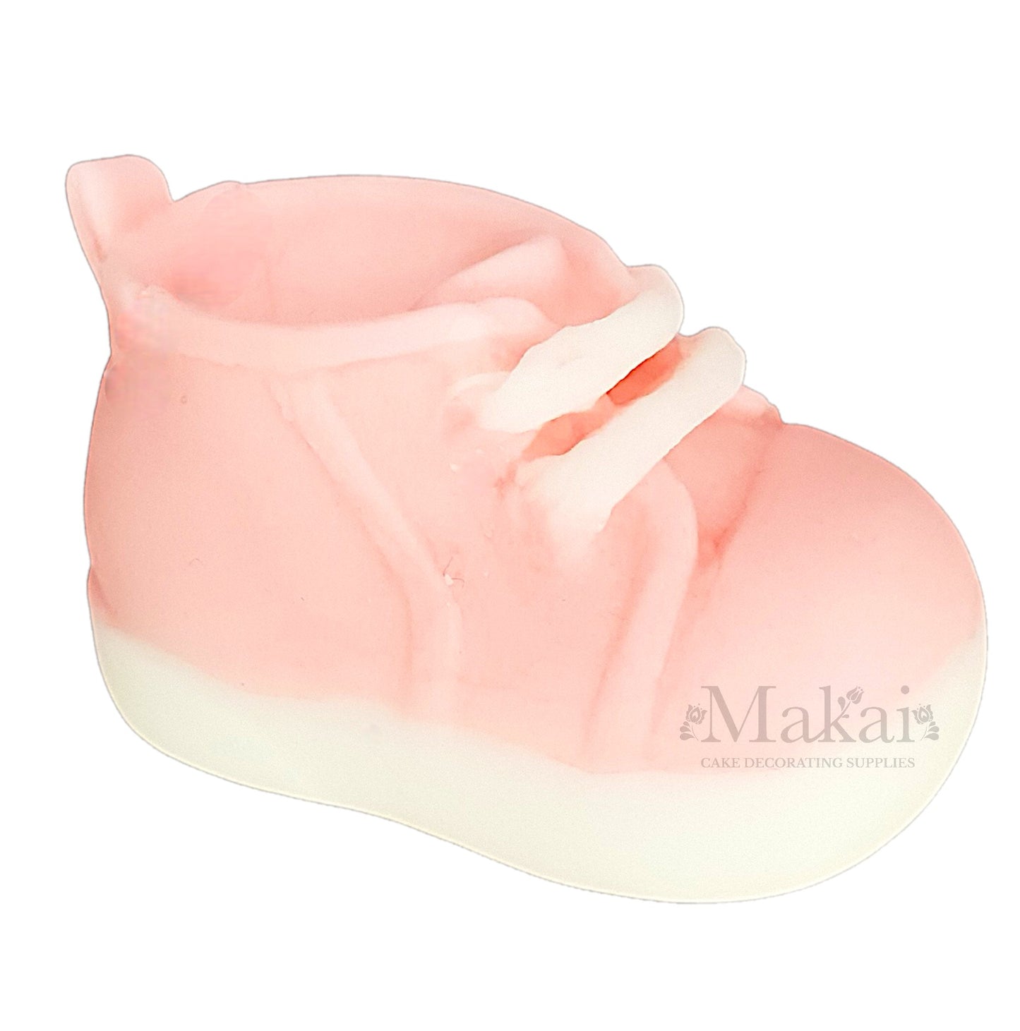 Pink baby girl shoe cake topper decoration on a white background