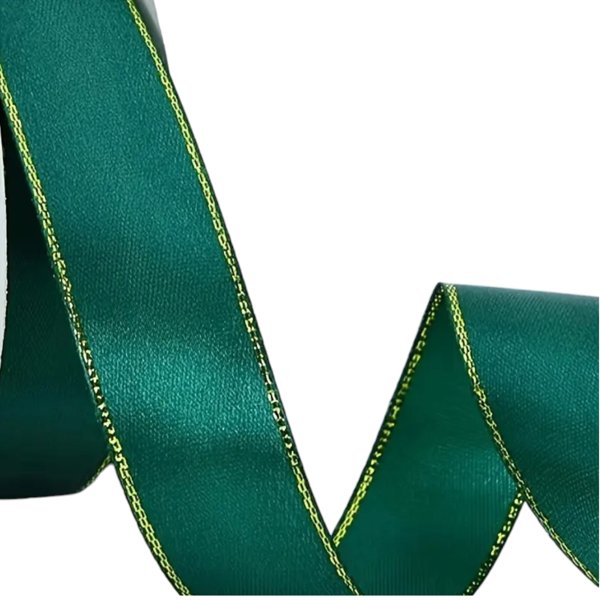 Dark green satin ribbon with gold edge, rolled and partially unspooled on a white background – 2.5 cm wide.
