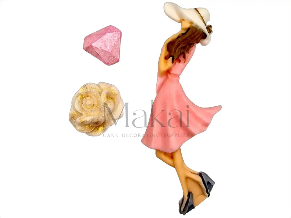 Soft pink and white edible cake decoration set with a sugar diamond and a white rose with gold accents.