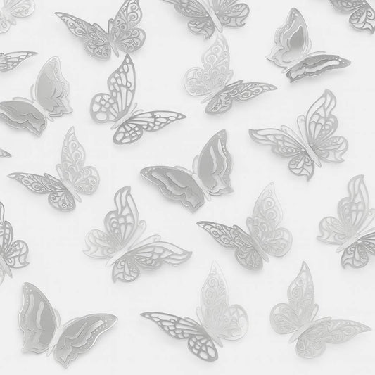 Set of six silver mirror butterflies with swirl cut-out wings, perfect for cake decoration in magical or elegant themes