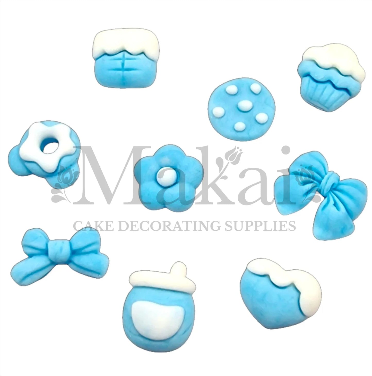 Set of ten blue fondant baby‑boy accessories—bows, bottle, cookie, cupcake and heart—for edible cake decorating.