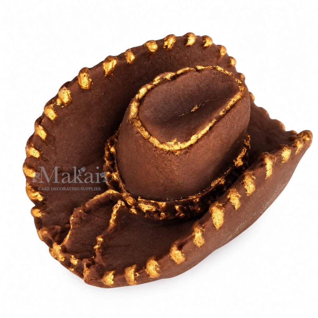 Side view of brown fondant cowboy hat cake topper with decorative gold trim