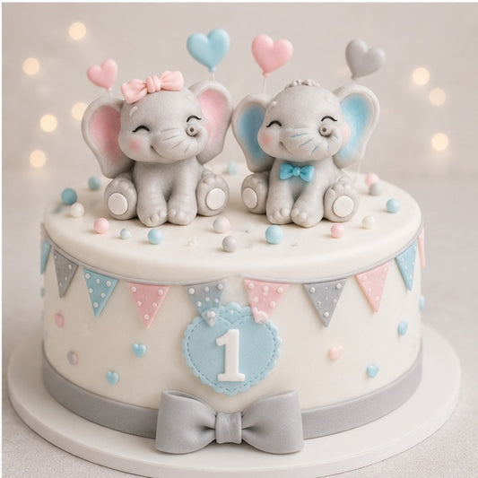 Cake with elephant boy and girl decorations and colourful elements on a light background