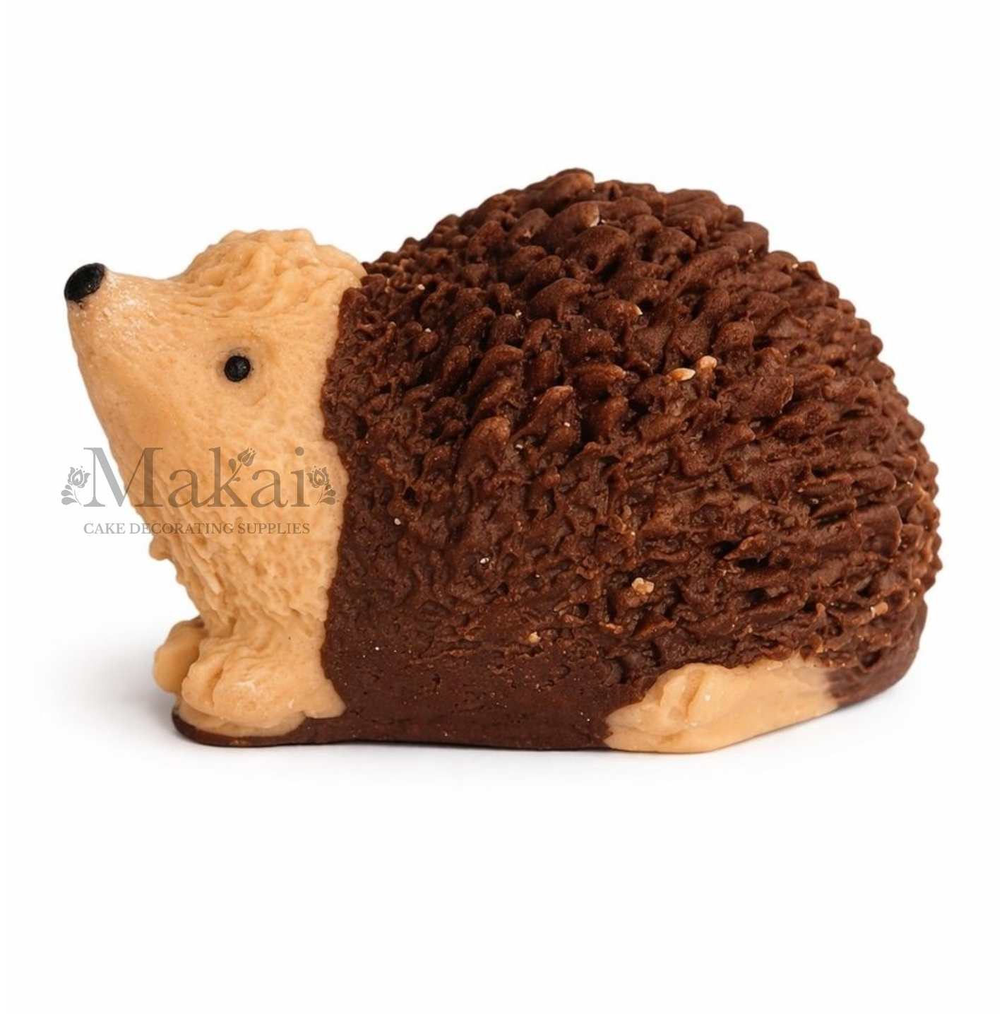 Side view of a fondant hedgehog cake topper in cream and dark brown colours