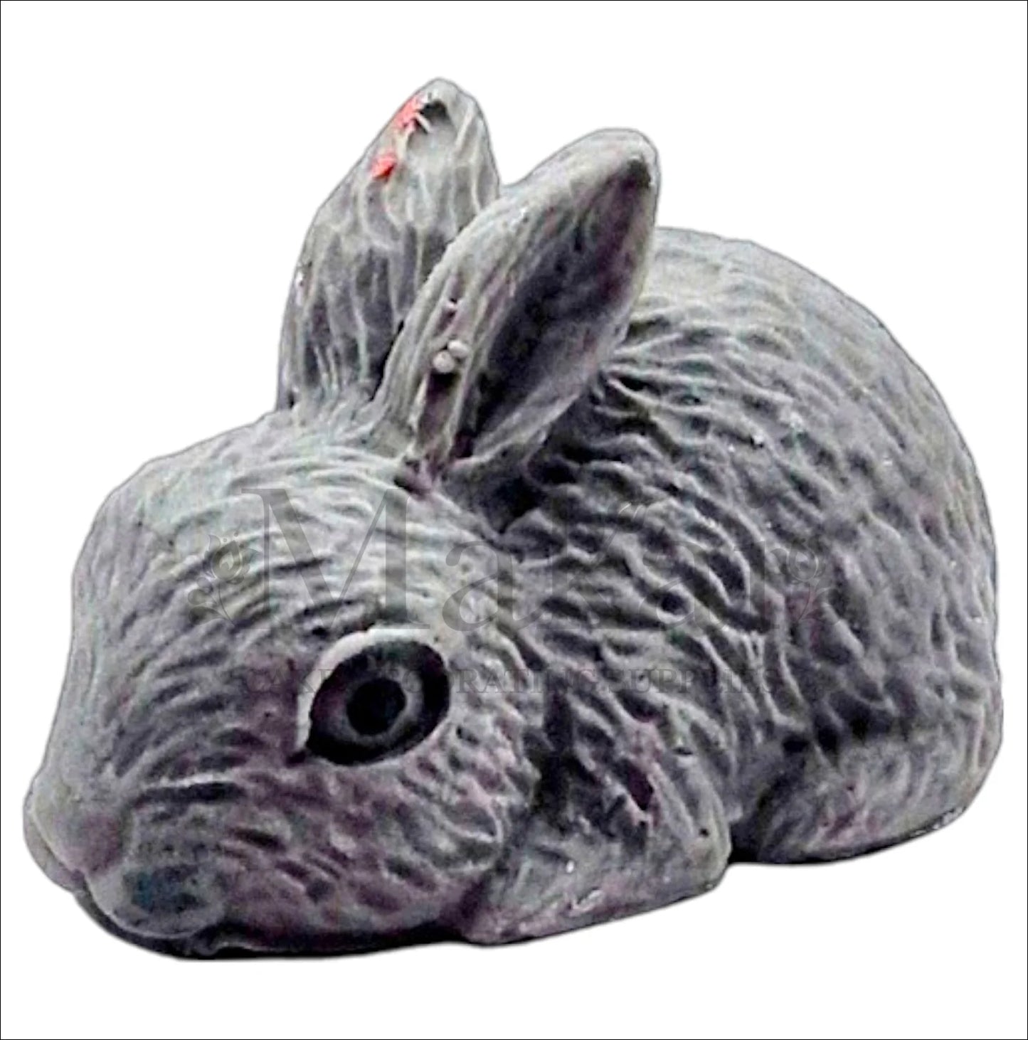 Realistic large grey rabbit cake topper lying down.