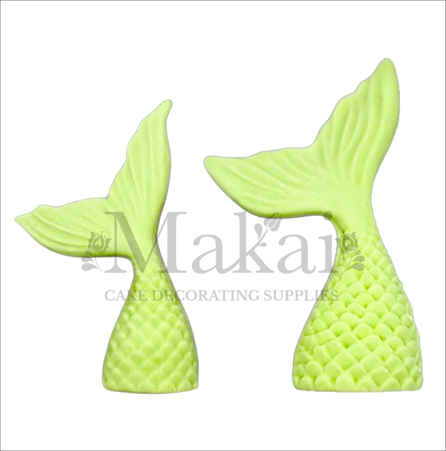 Set of two light green edible mermaid tail cake toppers for ocean and fantasy cake themes.