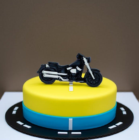 Motorbike cake decoration on yellow and blue fondant cake with road design – Makai Cake Decorating Supplies