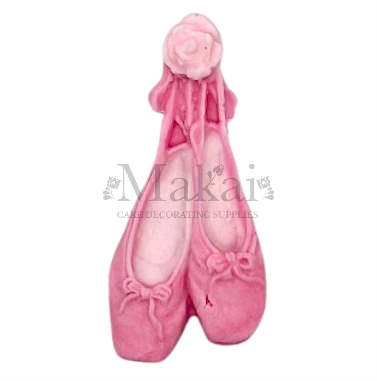 Pink ballerina shoe cake topper with ribbons for baby‑girl and dance‑themed cakes.
