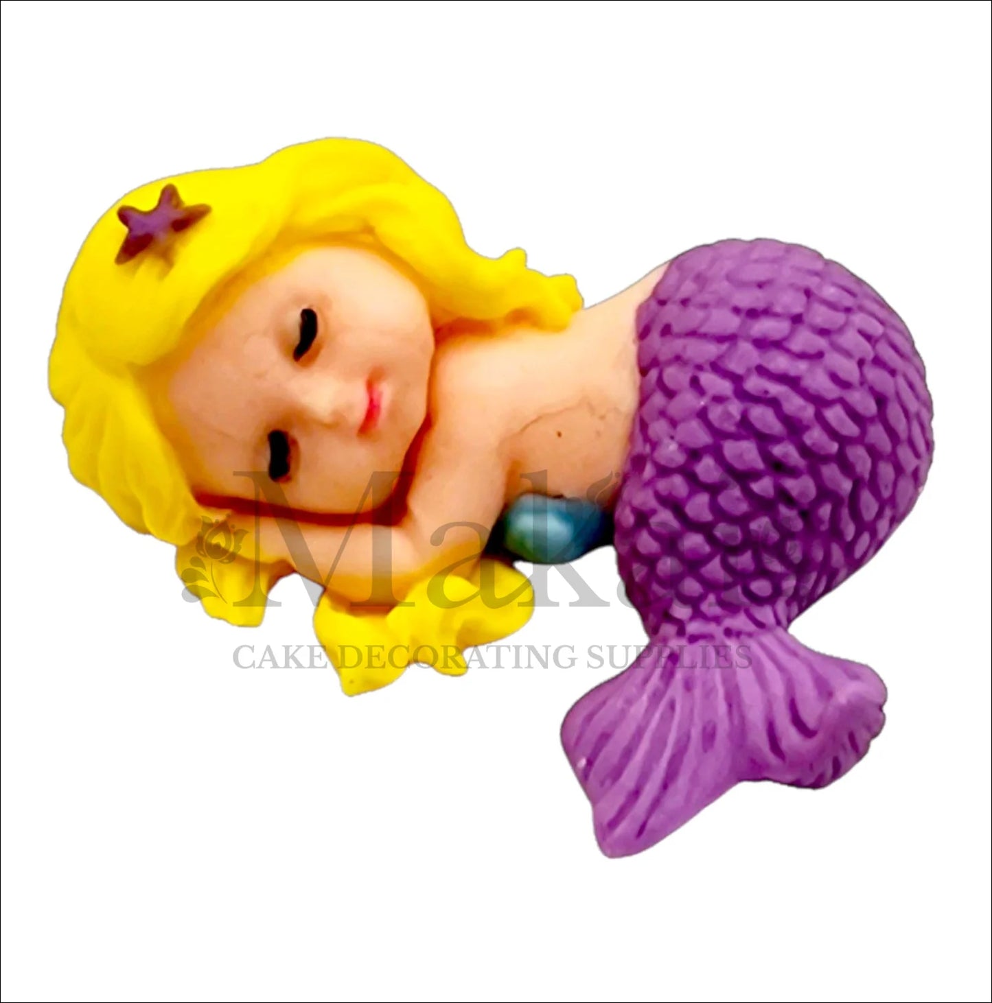 Sleeping mermaid baby edible cake topper with purple tail and blonde hair, ideal for fantasy and underwater-themed cakes.