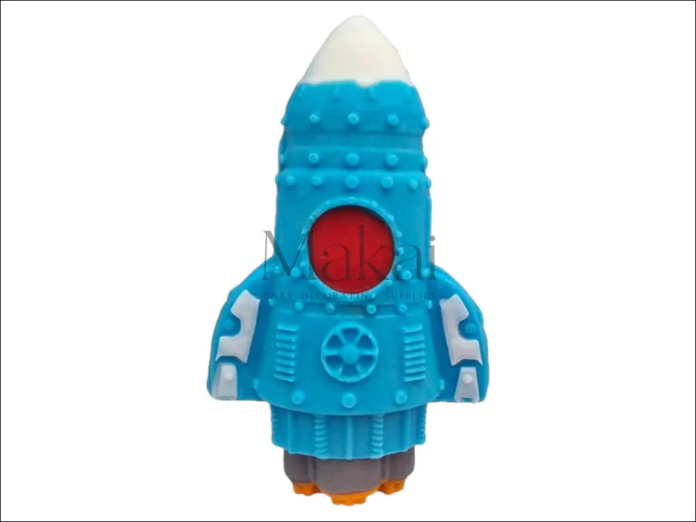 A blue spaceship cake topper with a white nose, orange flames, and grey exhaust, perfect for space-themed cakes.