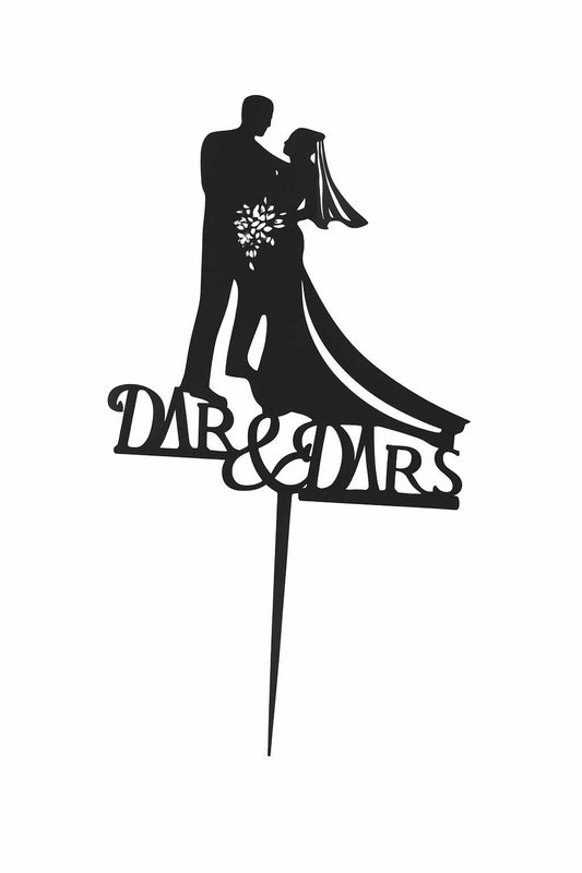 Black wedding cake topper with bride holding bouquet and “Mr & Mrs” silhouette design