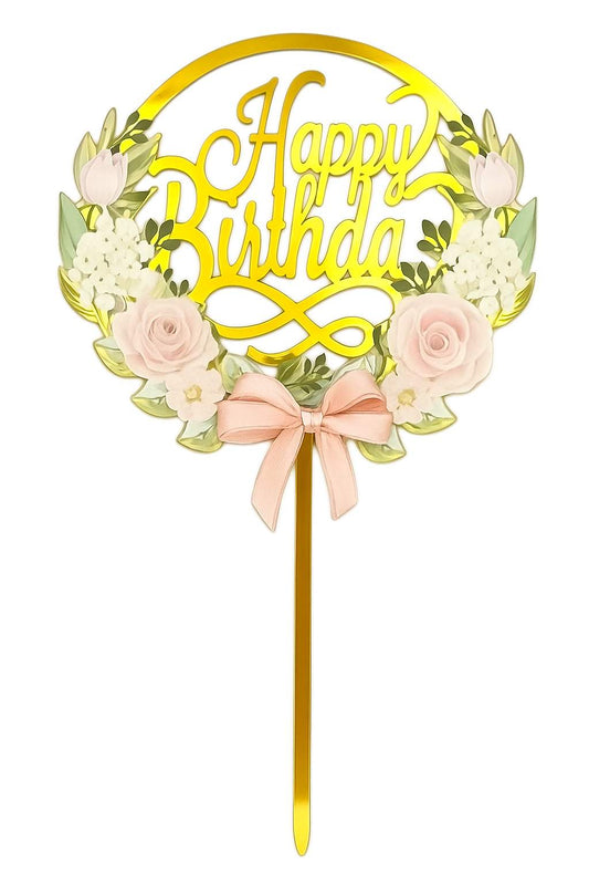 Gold mirror acrylic “Happy Birthday” cake topper with pink florals, white blossoms and pink bow accent in a circular wreath design