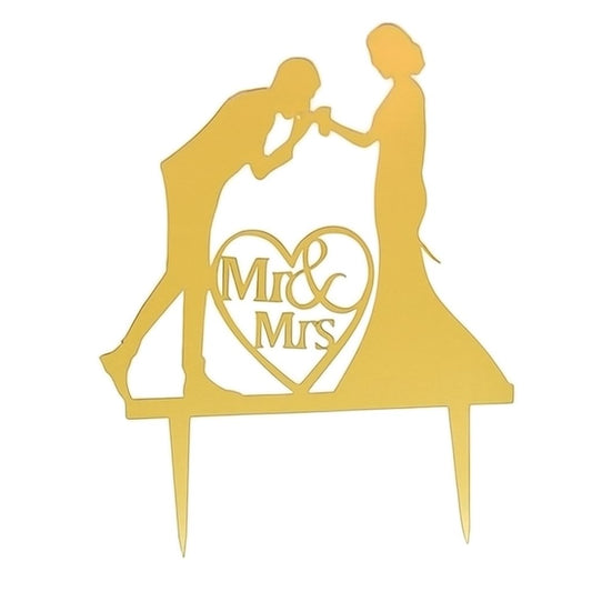 Gold acrylic cake topper with groom kissing bride’s hand and “Mr & Mrs” in heart shape