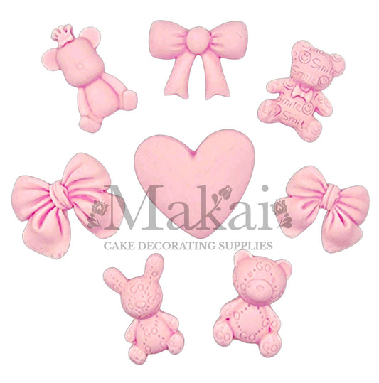 Edible pink baby girl cake toppers including teddy bears, bows, heart and bunny—perfect for baby showers and girl birthday cakes.