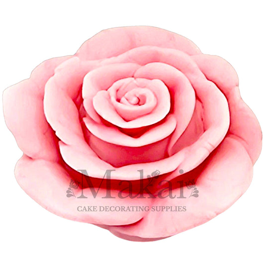 Large baby‑pink fondant rose topper for bridal‑shower and christening cakes.