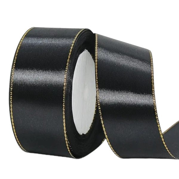 Black satin ribbon with metallic gold edge, 2.5 cm wide – perfect for cakes, crafts and elegant gift wrapping.