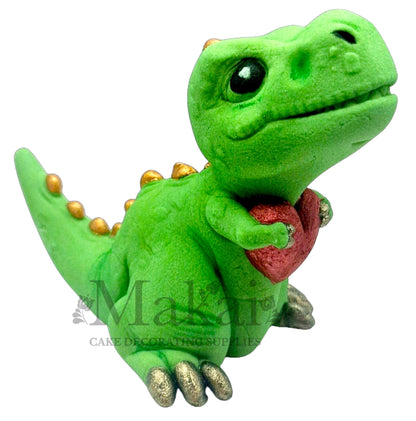 Edible extra large green dinosaur cake topper holding red heart with gold details—perfect for dinosaur-themed celebrations.