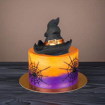 Halloween cake with handcrafted witch hat topper, ideal for spooky celebrations