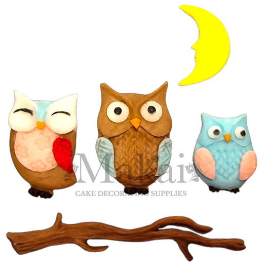 Edible owl cake topper set with three fondant owls, yellow moon, and branch—perfect for woodland-themed cakes.