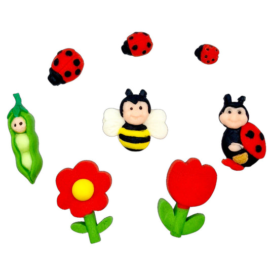 Edible cake decorations featuring ladybirds, bees, flowers, and a pea pod, perfect for spring and garden-themed cakes.