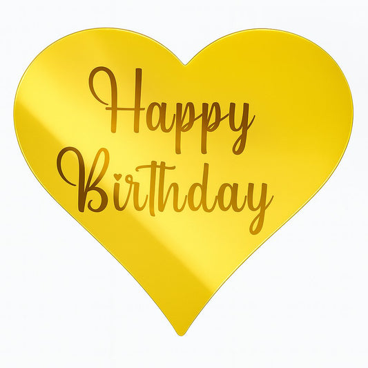 Gold heart-shaped acrylic cake topper with “Happy Birthday” text