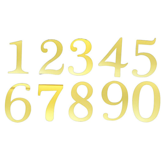 Set of gold acrylic number cake toppers from 0 to 9