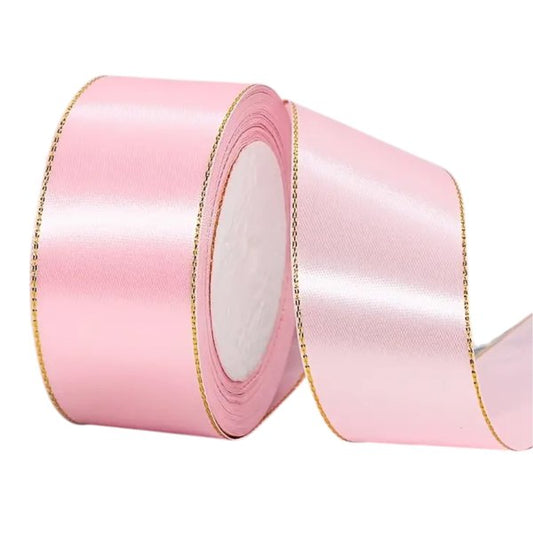 Pink satin ribbon with gold edge, 2.5 cm wide – perfect for cakes, baby showers and romantic gift wrapping.