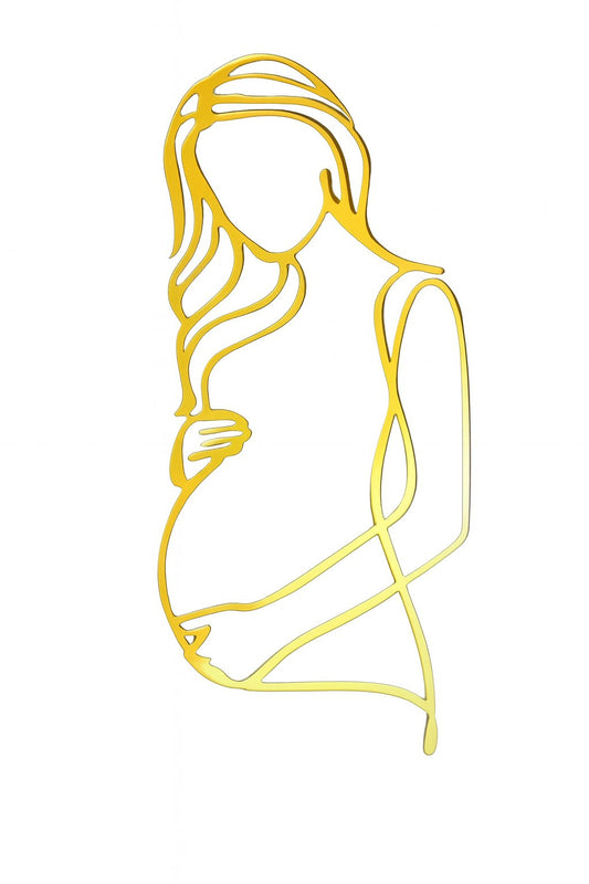Gold silhouette of a pregnant mum cake topper for baby shower or gender reveal