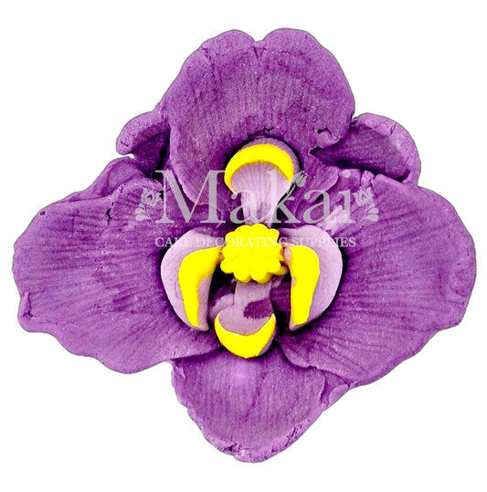 Large edible purple orchid fondant flower with yellow detail for luxury cakes.