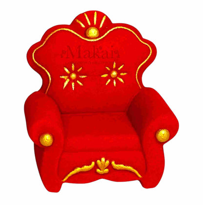 Red miniature royal-style armchair cake topper with gold decorative details