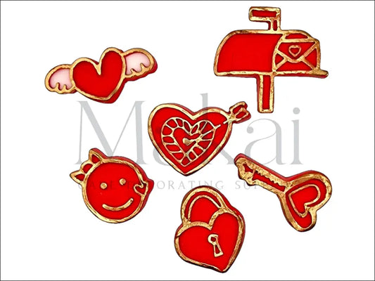 Red and gold fondant love-themed set with heart with wings, mailbox, heart lock, key, smiling face, and heart pierced by an arrow for cake decoration.
