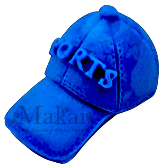 Royal‑blue fondant sport cap cake topper for gamer and nautical themes.