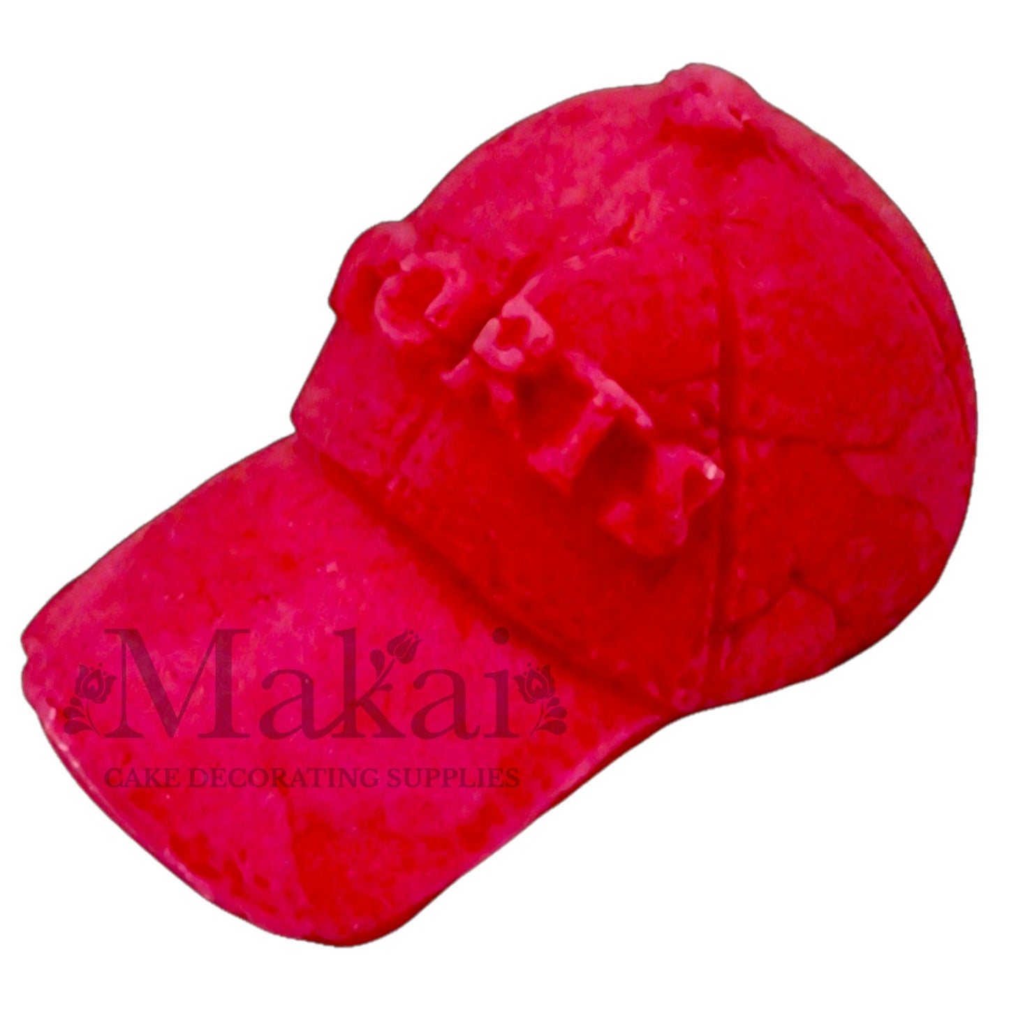 Bright‑pink fondant sport cap topper with visor and SPORTS text.