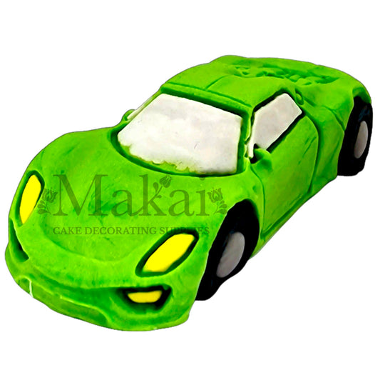 Edible light‑green sport car fondant topper adds a racing vibe to cakes.
