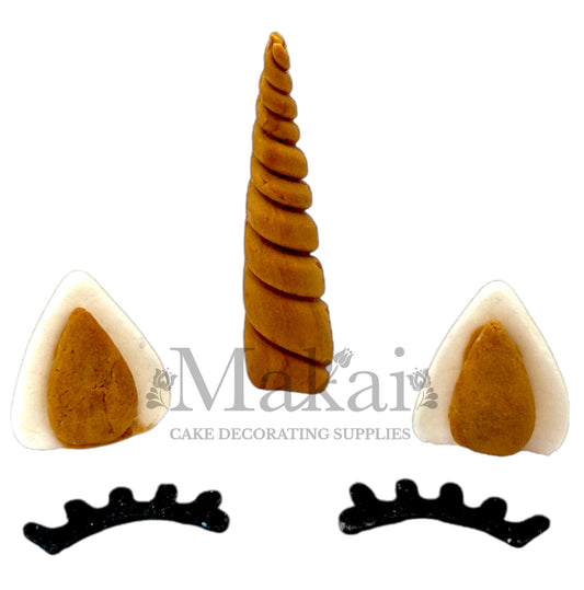 Edible sugar unicorn horn, ears and lashes cake topper set for magical birthday or baby shower cakes.