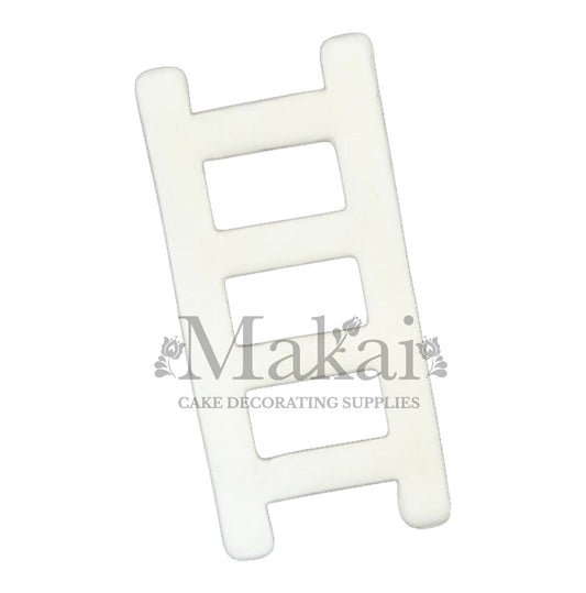 White fondant ladder topper for wedding and winter cakes.