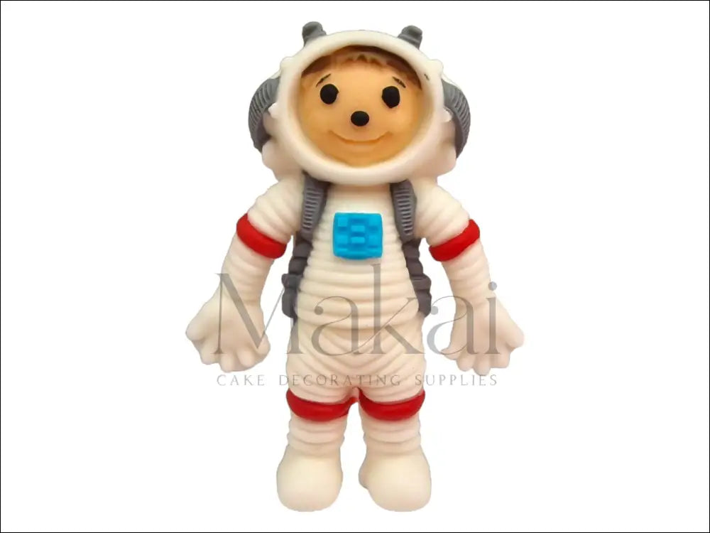 Handcrafted fondant astronaut cake topper in a white spacesuit with red and blue details, perfect for space-themed cakes.