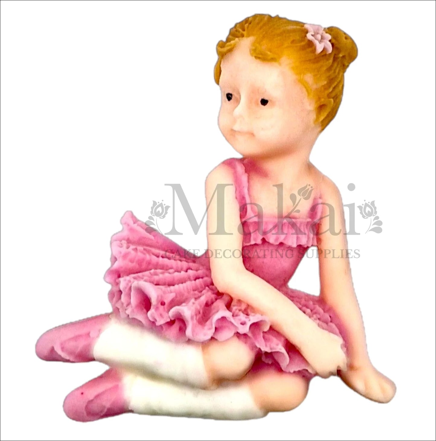 Baby girl ballerina in pink tutu sitting cake topper.