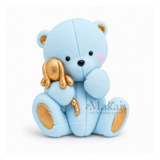 Baby blue teddy bear fondant cake topper with gold bunny decoration, front view