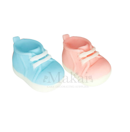 Pink and blue baby shoe fondant cake toppers for baby shower and gender reveal cakes.