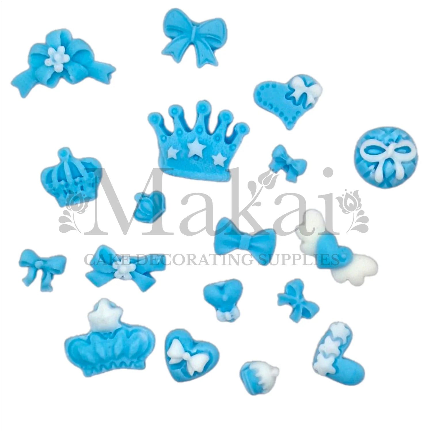 Set of edible blue fondant crowns, bows, hearts and baby accessories for prince‑themed cakes and cupcakes.