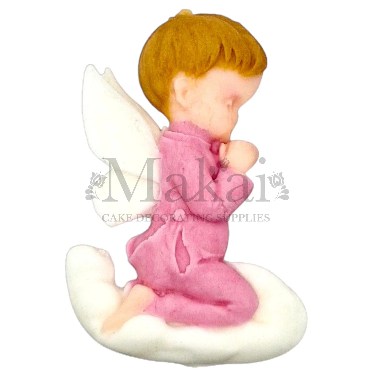 Kneeling baby girl angel cake topper in pink pyjamas praying on a white cloud.