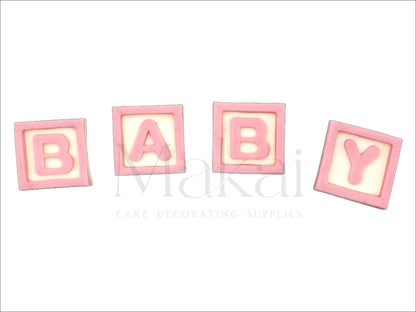 Pink fondant baby letter blocks spelling "BABY" – baby shower cake decoration.