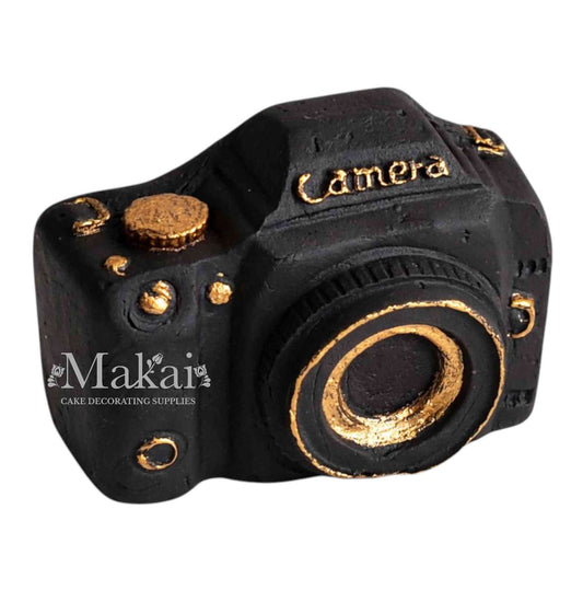 Black fondant camera cake topper with gold details for photography themed birthday cakes