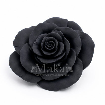Black handmade fondant rose cake decoration with detailed layered petals on a white background, Ideal for wedding cake