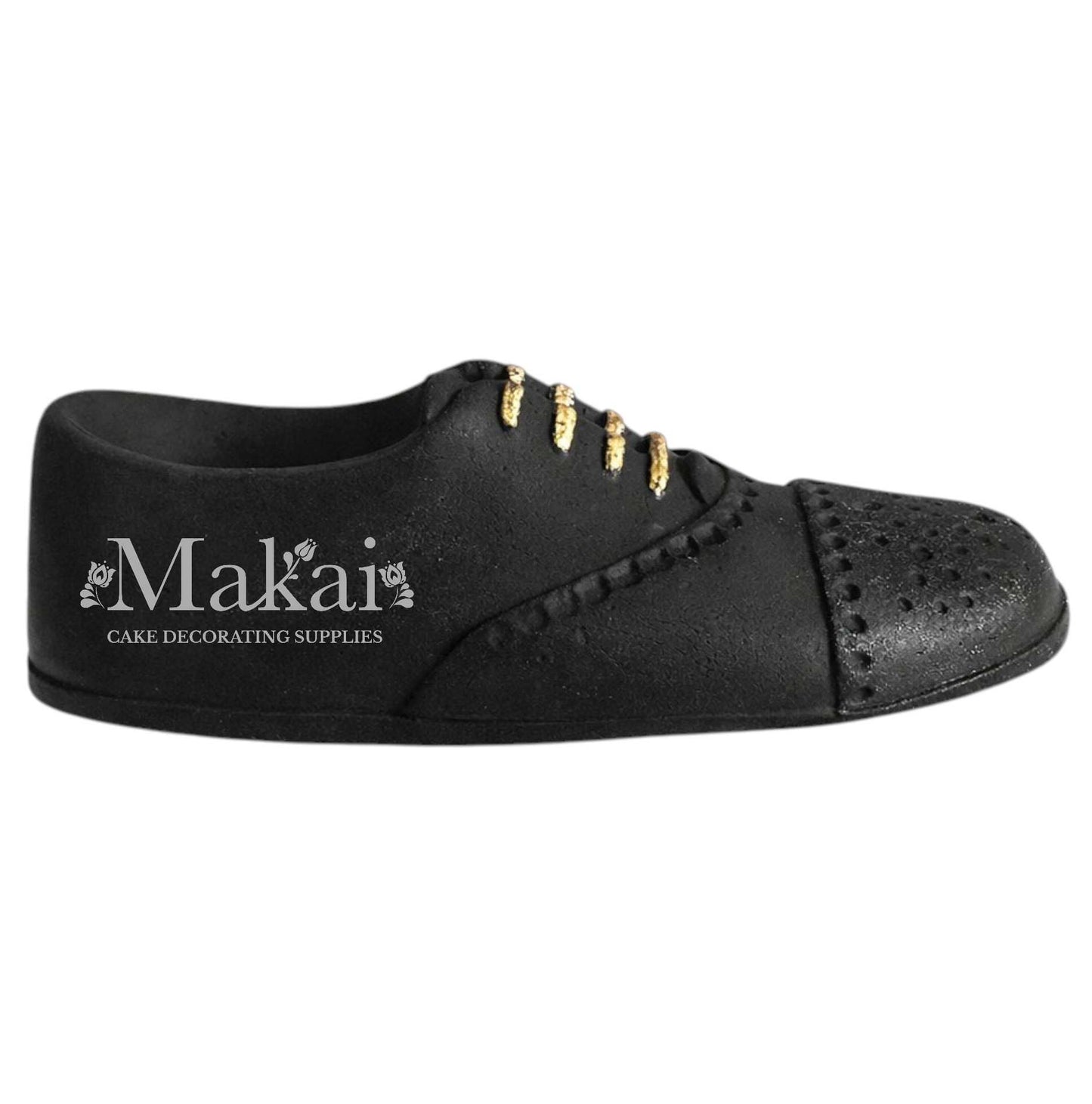 Black gentleman shoe fondant cake topper with gold details, side view, elegant birthday cake decoration