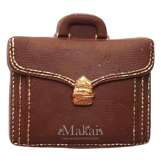 Gentleman briefcase cake topper with gold details for masculine celebration cakes