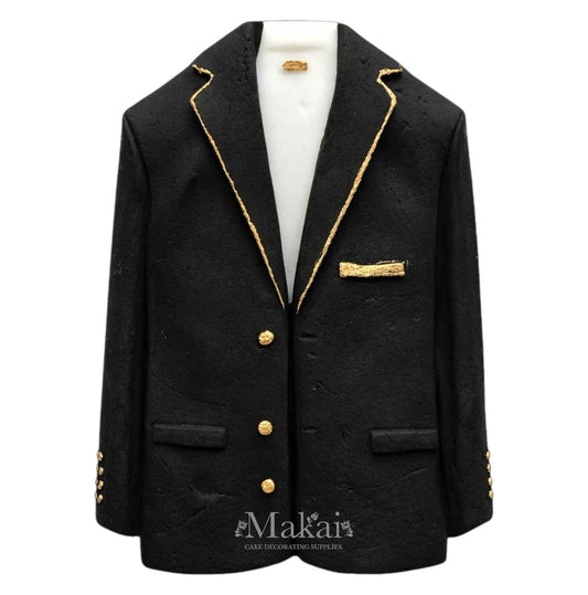 Handcrafted black suit jacket cake topper with gold details for elegant celebration cakes.