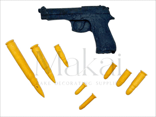 Edible black gun cake topper with 8 assorted bullet decorations – action or police-themed cake.