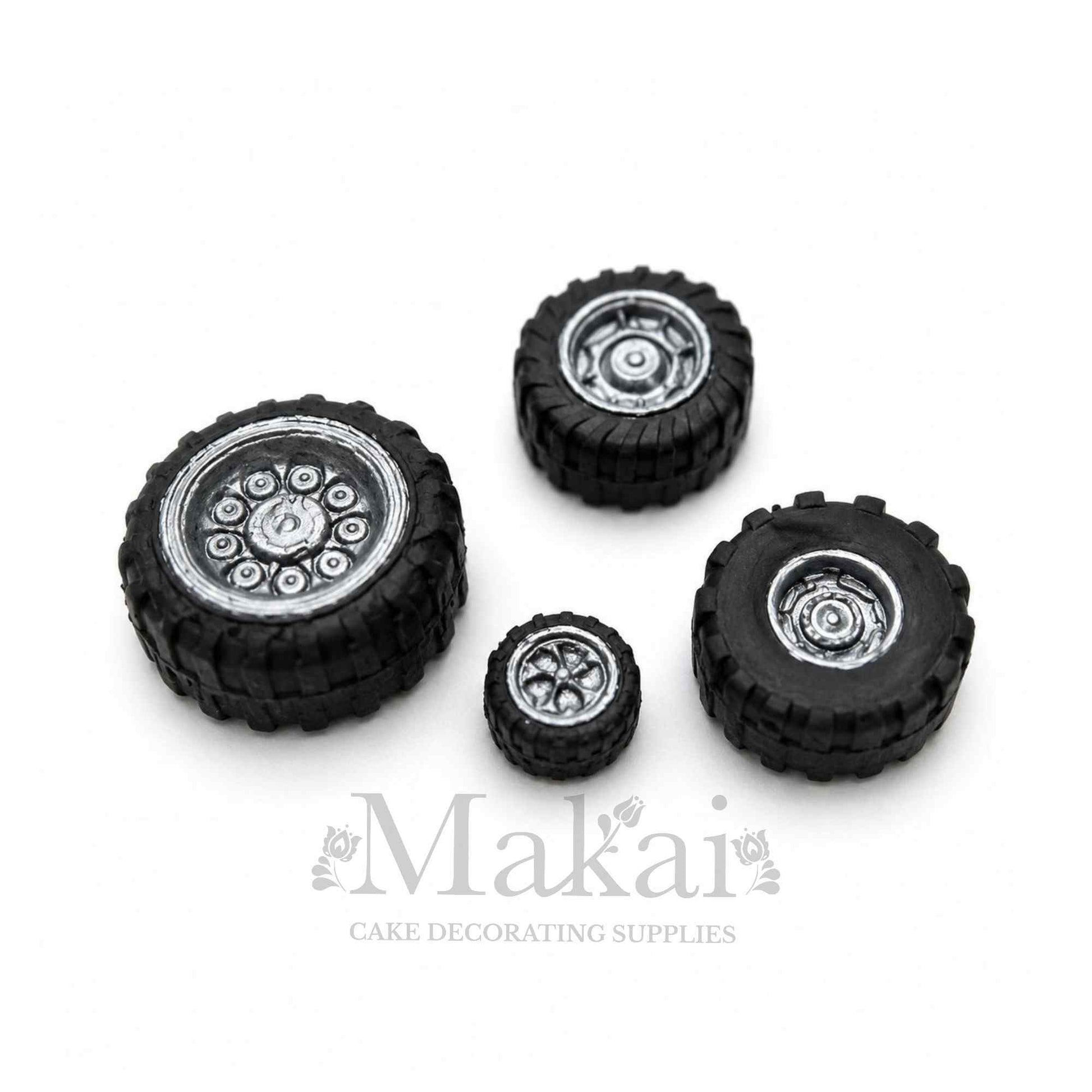 Fondant tyre and wheel cake decorations set on white background